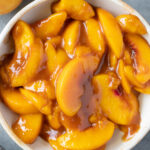 A bowl full of homemade peach pie filling