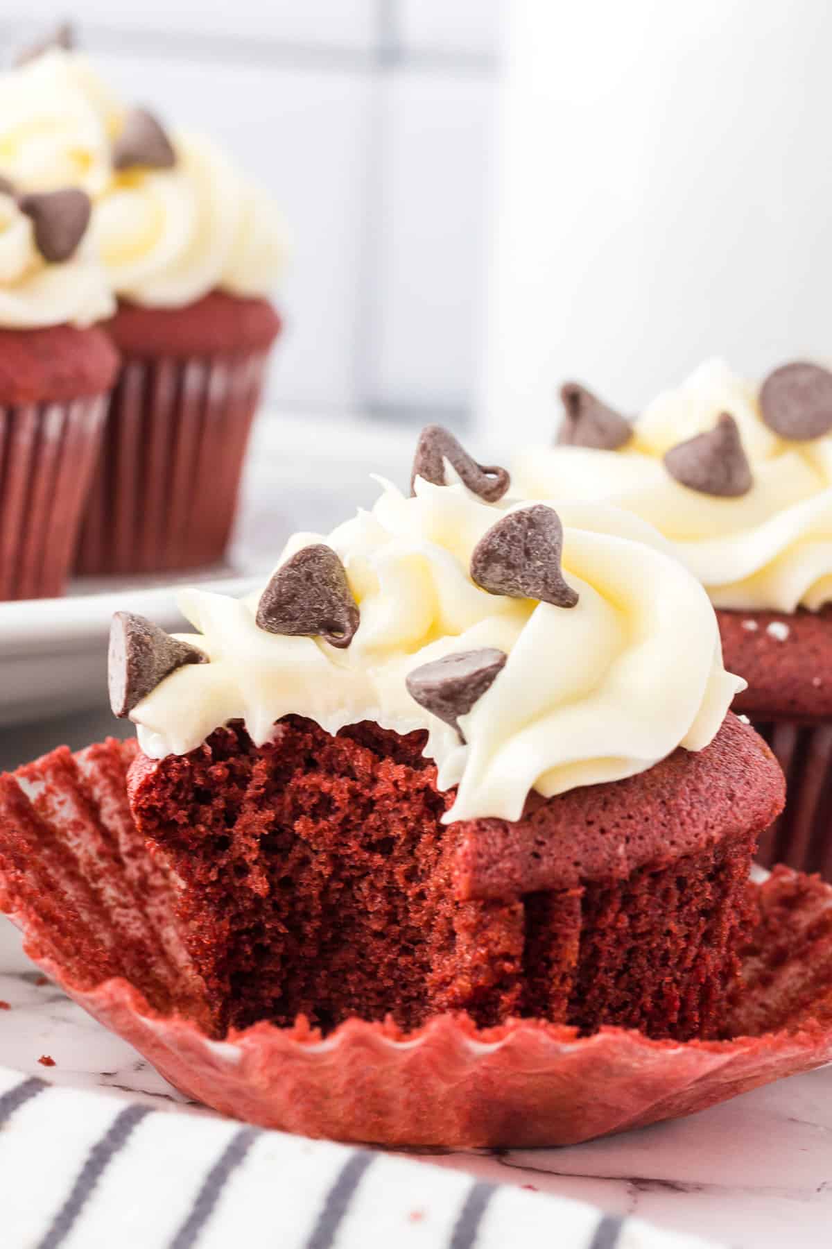 red velvet cupcake with a bite taken out