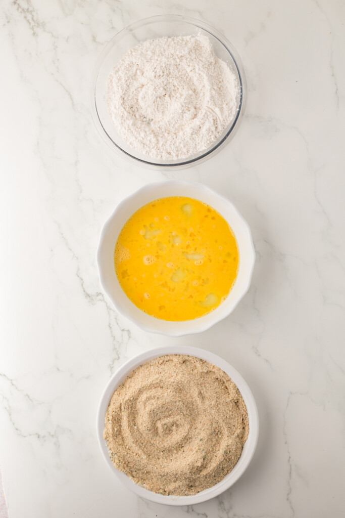 Flour, eggs and breadcrumbs in bowls