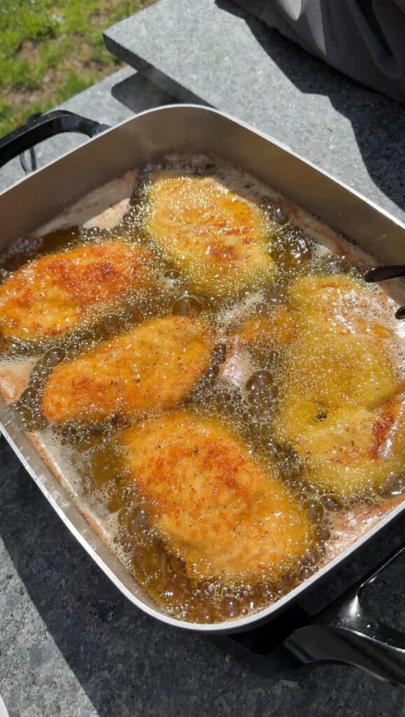 Chicken Cutlets frying in a frying pan
