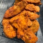 Italian Chicken Cutlets on a baking sheet